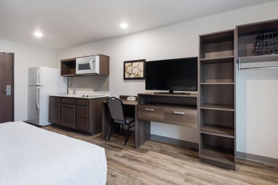 Kick back with a big TV and a practical work desk.