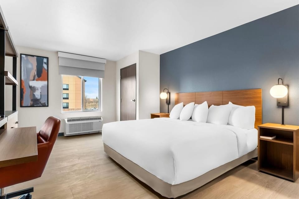 Wake refreshed in a modern room with calming tones.