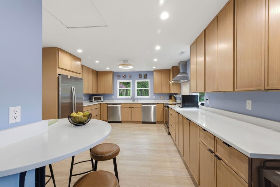 Fully equipped kitchen ideal for group meals, with built-in table, seating and second fridge (not pictured)