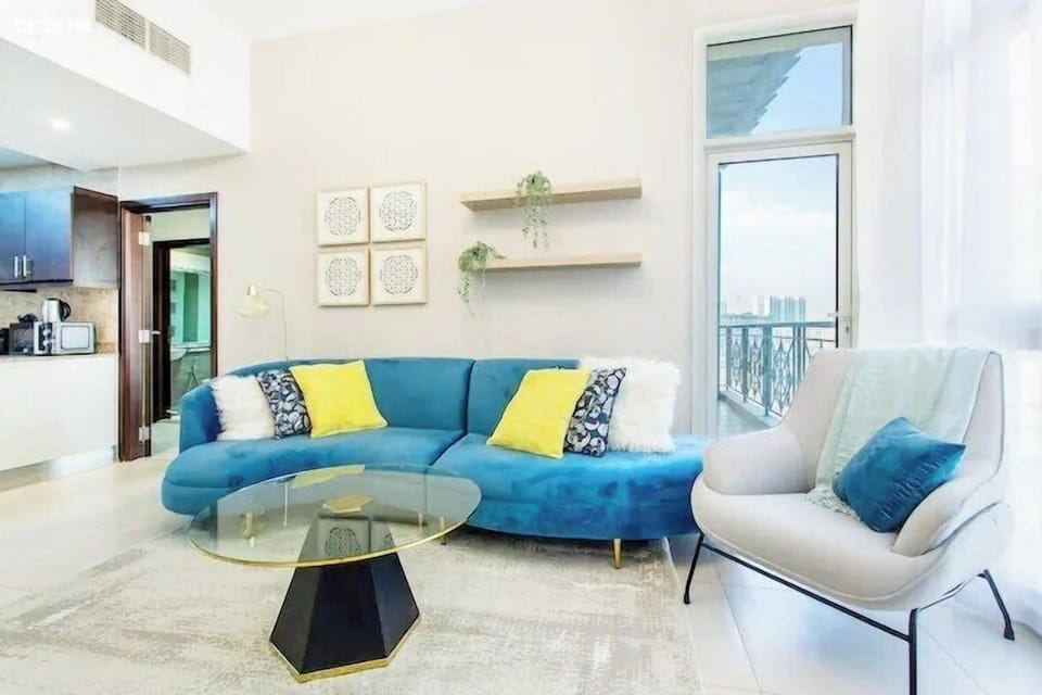 Living Area: "Gather for memorable meals at our cozy dining table in the living room, where shared moments and delicious dishes create lasting memories."