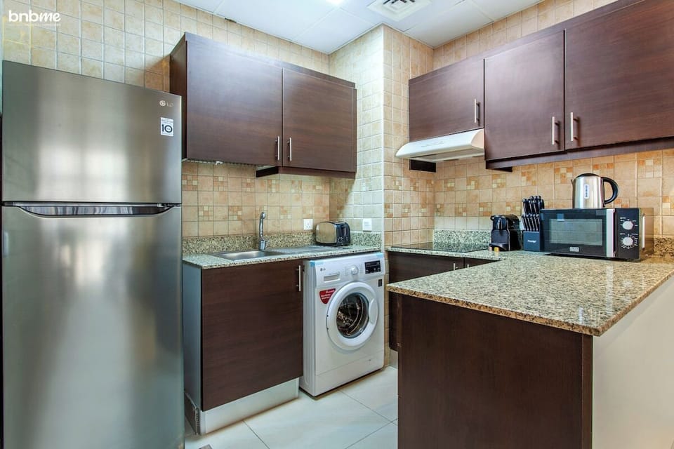 Kitchen: "Prepare delicious meals in our fully-equipped kitchen, complete with modern appliances for your culinary needs."
