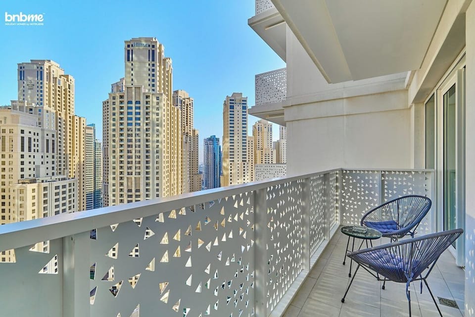 Take in the bustling cityscape from the comfort of your private balcony.