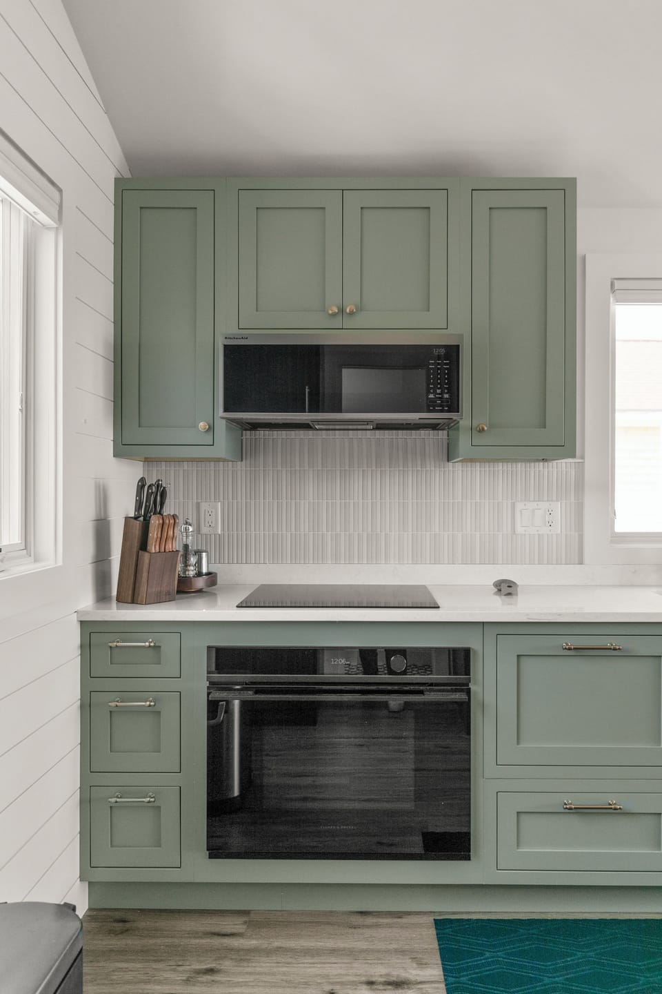 The modern kitchen is equipped with full-size appliances