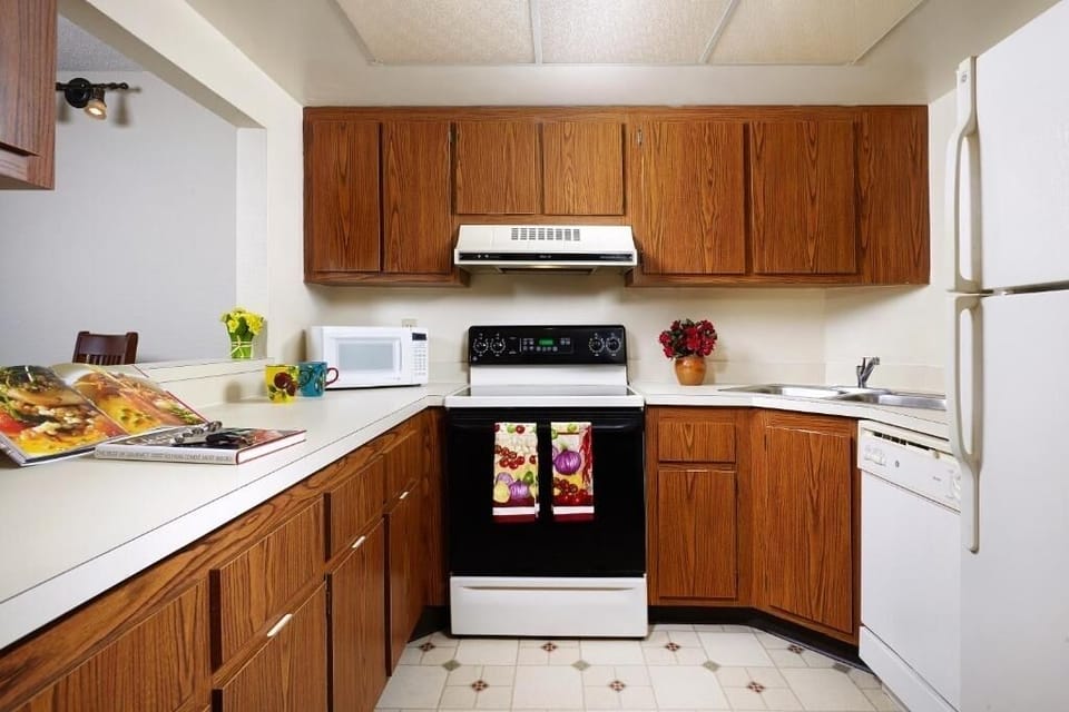 Prepare meals with ample counter space and classic cabinetry.