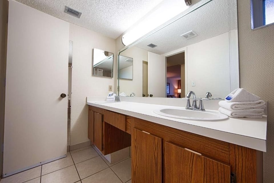 Refresh easily with a spacious vanity and bright mirror lighting.