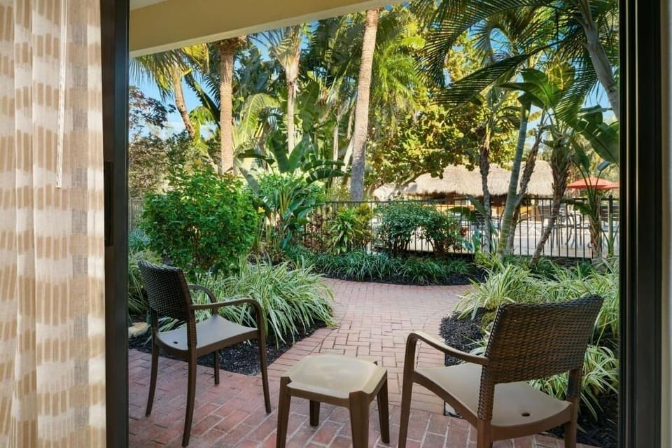 Step outside and lounge in the sunshine among tropical greenery.