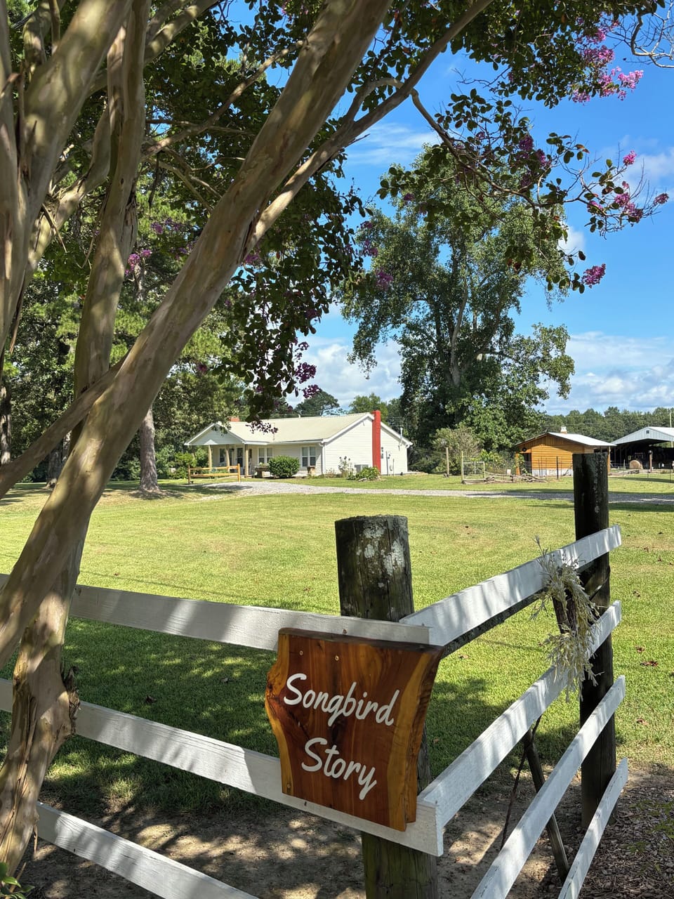 Entrance to Old Cottonwood Farm. Songbird Story Farmhouse and gazebo pictured.