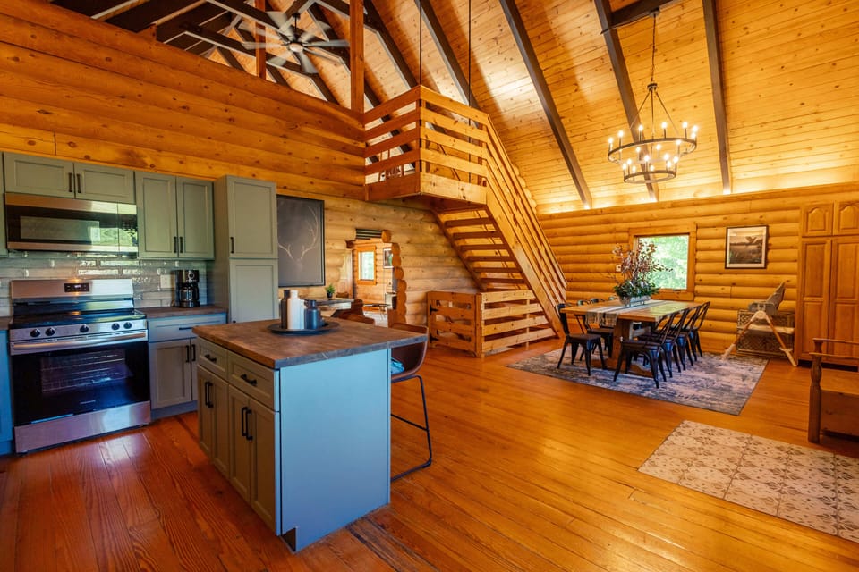 Kitchen and Dining Room with Stairway to Loft