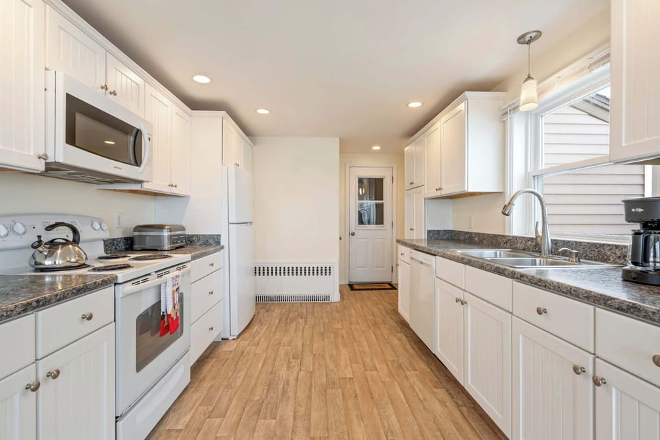 Spacious kitchen with ample storage and room to cook.