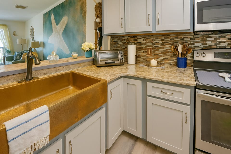 Fully equipped kitchen with modern appliances and coastal-inspired décor
