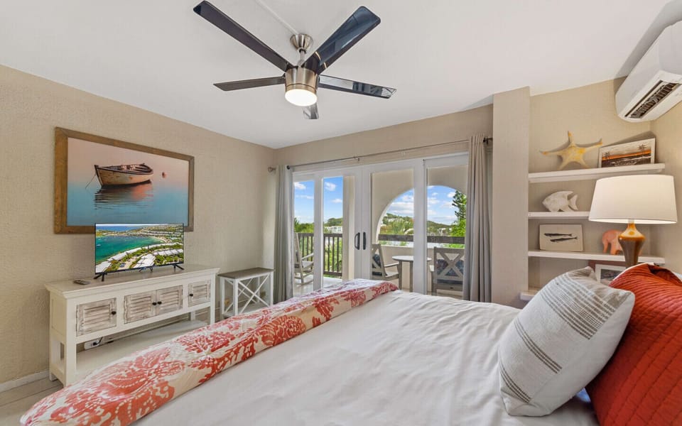 Bedroom 1 - ensuite bath, king bed,  balcony access, flat screen TV and cold AC.