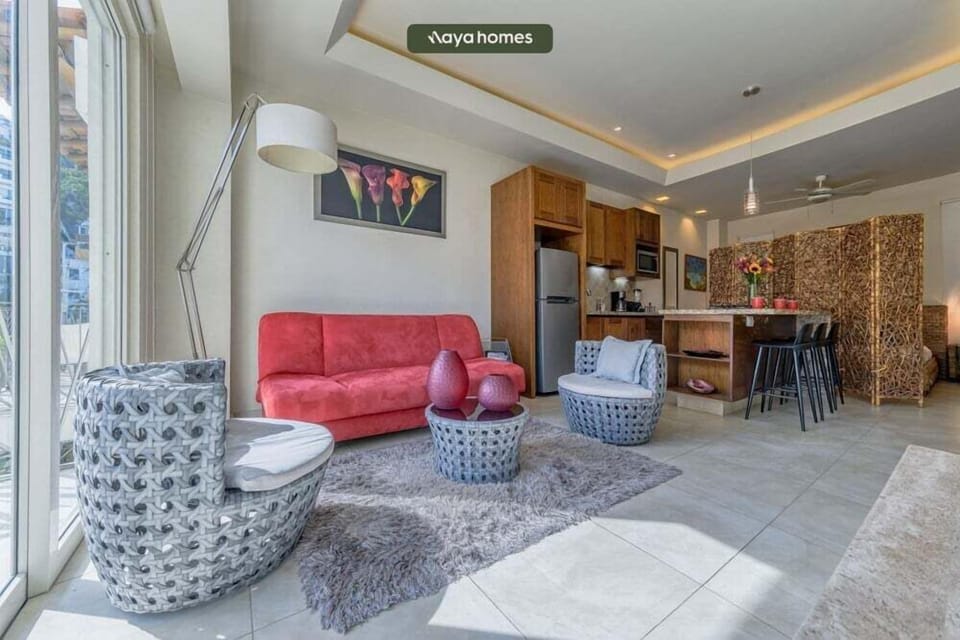 Relax in this modern, open-concept living room. It's the perfect cozy spot to unwind after a day out.