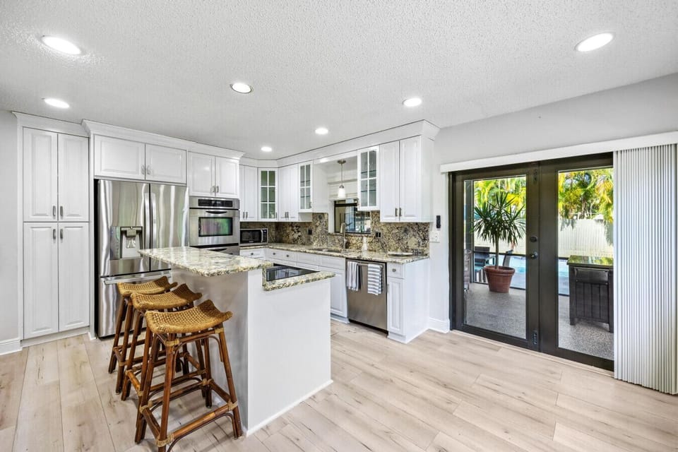 Contemporary lounge with designer coffee table, open kitchen, and fresh style
