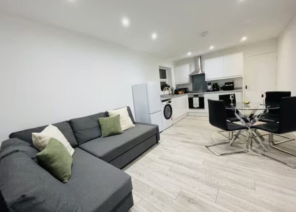 Bright lounge with comfortable seating and TV.