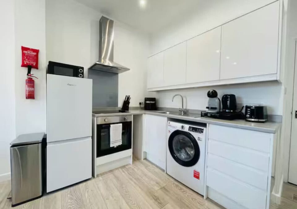 Fully equipped kitchen with modern appliances.