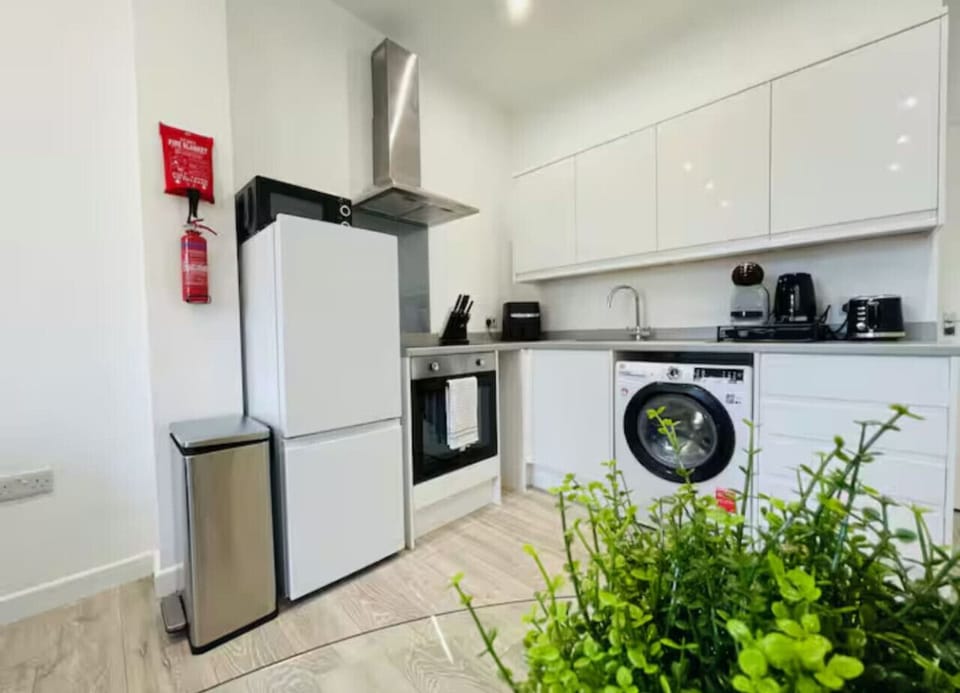 Fully equipped kitchen with modern appliances.