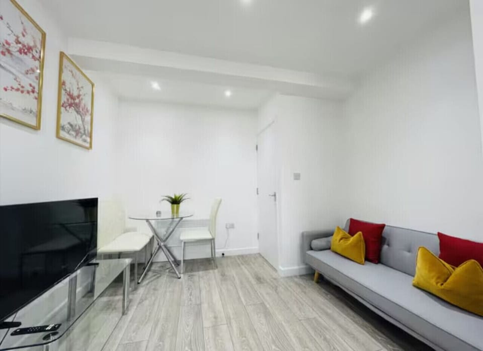 Bright and comfortable lounge with TV and high-speed WiFi, perfect for relaxing or working.