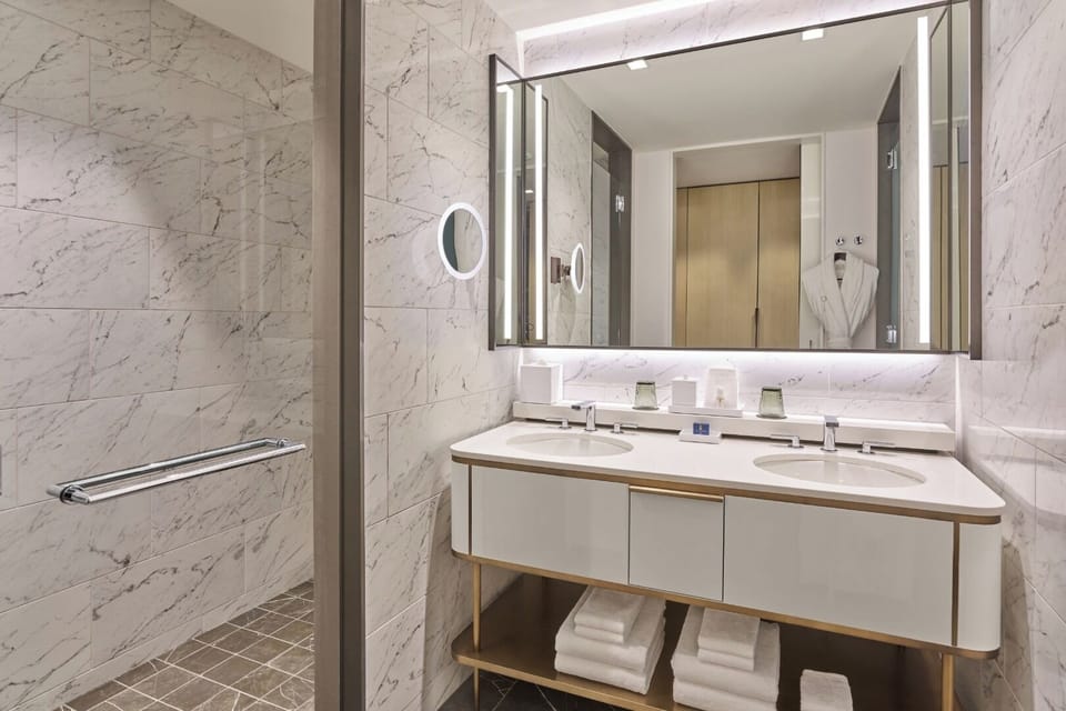 Refresh in a spa-like marble bath with double vanities.
