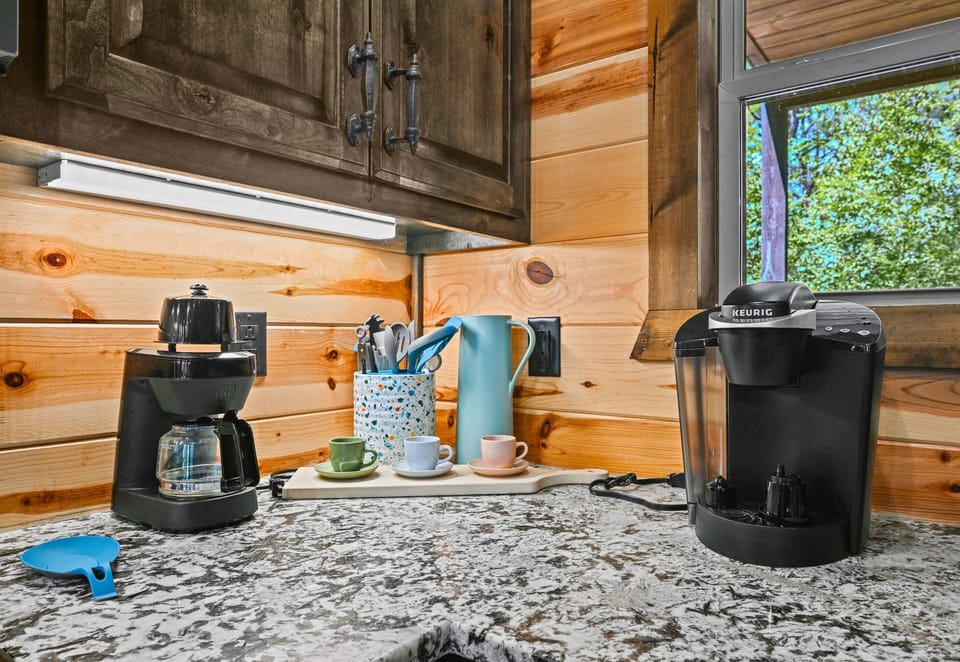 Your coffee bar awaits, featuring both drip and pod options—perfect for early risers and lazy mornings alike.