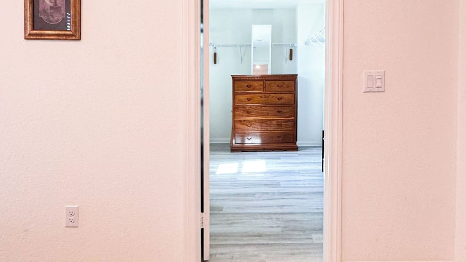 Master's closet - queen air mattress, spare linens/towels, & ironing facilities