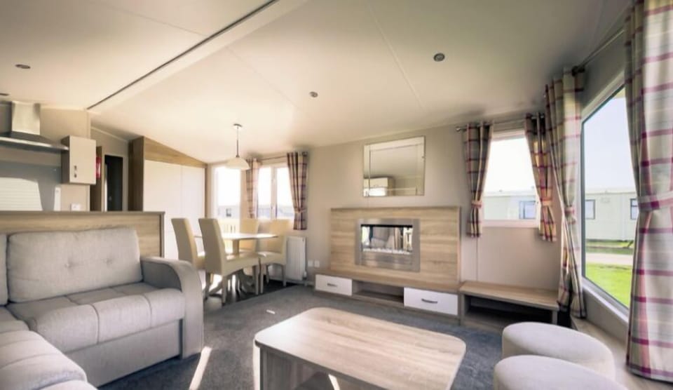 This is the living room it has a tv with 150 channels to choose from and a double pull out sofa bed that’s sleeps 2 people.