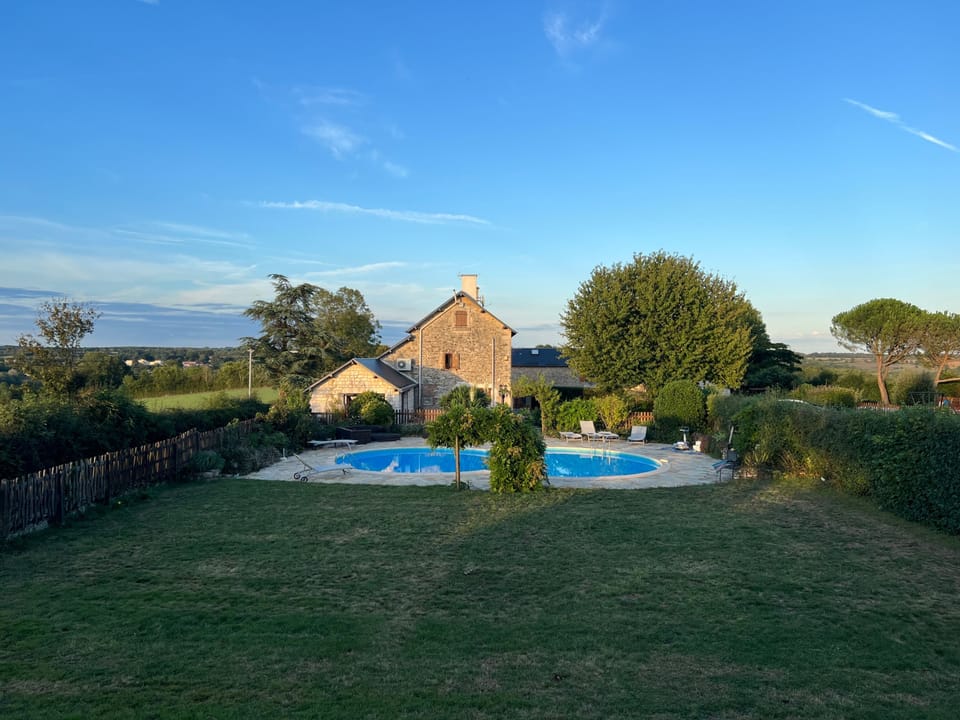 Stunning views of the farmhouse, swimming pool, gardens & countryside