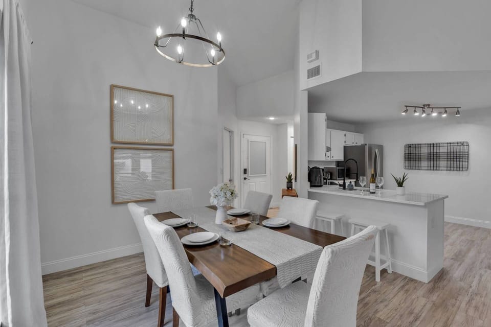 A seamless flow from kitchen to dining — table for six plus two barstools for extra seating.