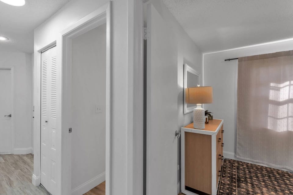 Hallway leading to three cozy bedrooms — perfect for family or group stays