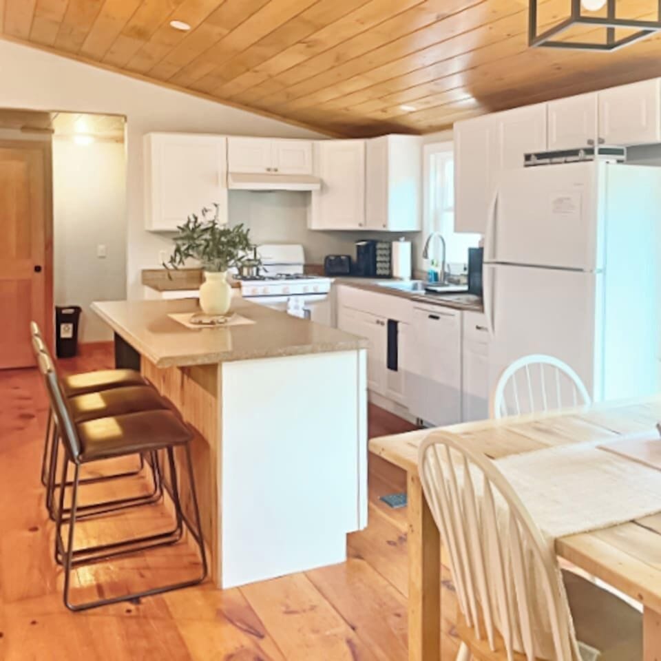 Fully stocked kitchen with big island that fits perfectly into the open floor plan of the home!  