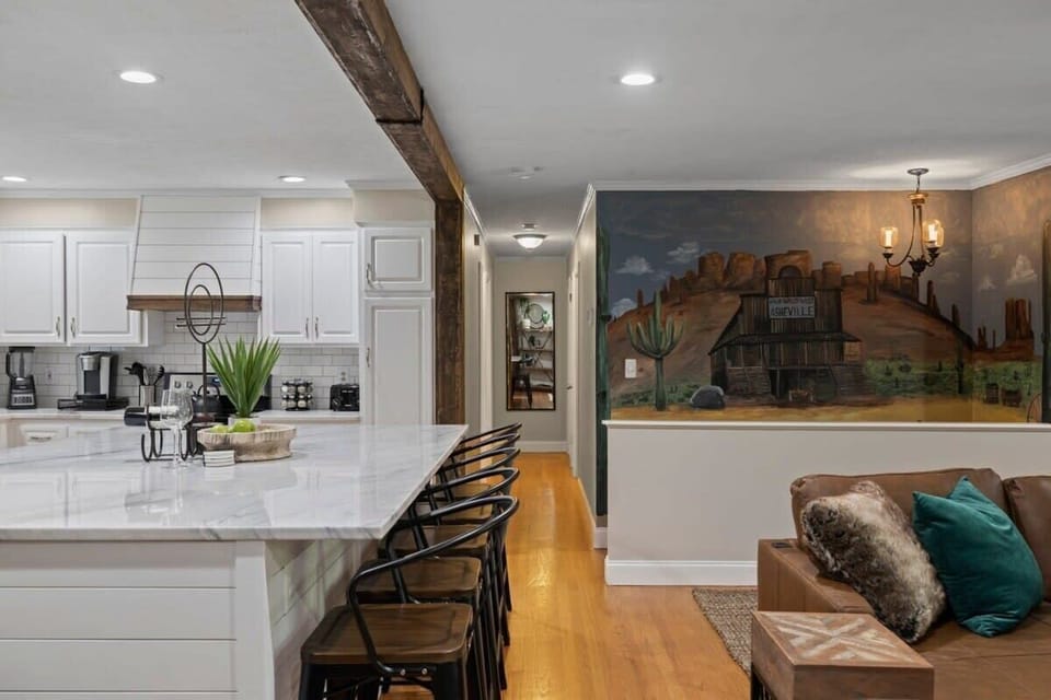 With its seamless flow between the living, dining, and kitchen areas, this space is designed for comfort, connection, and togetherness.