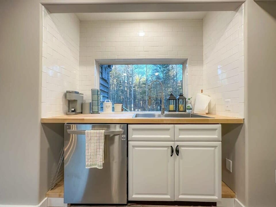 Wash dishes with a view — our fully stocked kitchen lets you soak in the outdoors right from the sink.