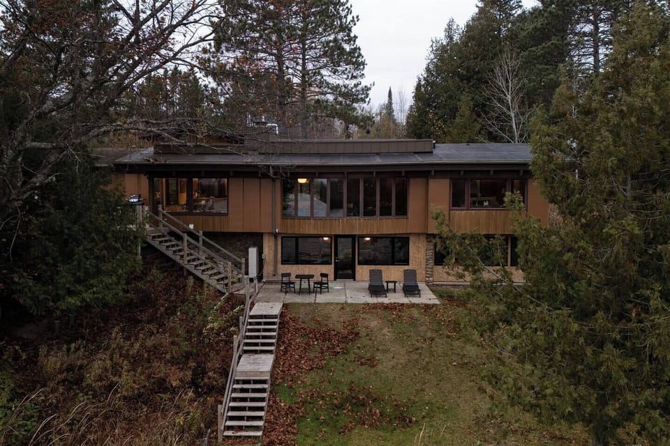 Mid-century design meets secluded Northwoods serenity.