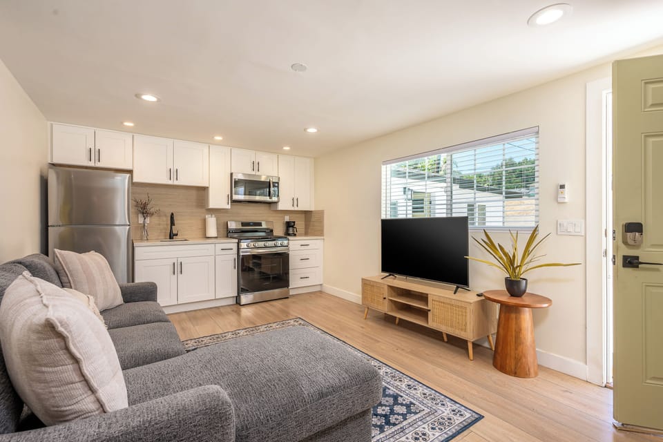 Relax in our stylish lounge with kitchenette and smart TV.