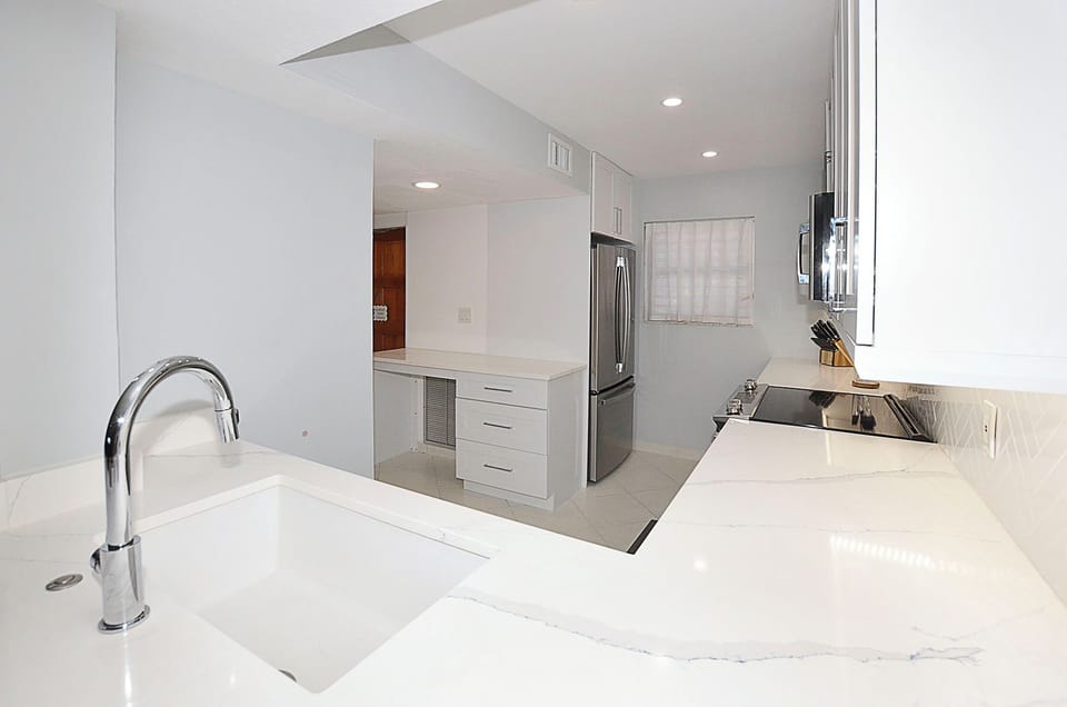 Kitchen with granite counter tops.