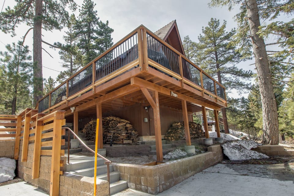 Arrive with ease using the private driveway, located just steps from the front door. Please note that the main entrance is accessed via exterior stairs, adding to the classic mountain-cabin feel.