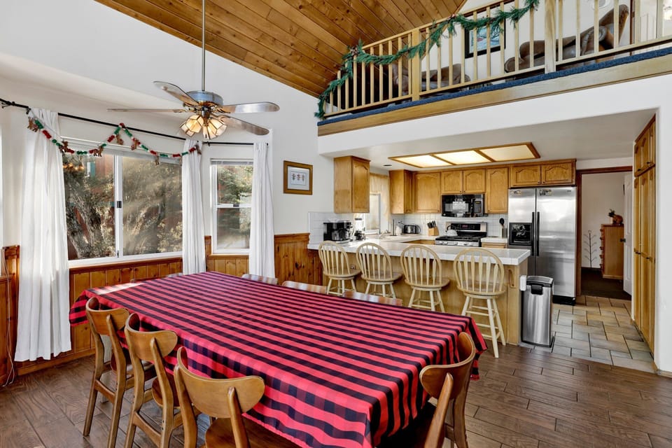 Gather and enjoy meals together in the fully equipped kitchen and dining area, featuring a dining table with seating for up to 8.