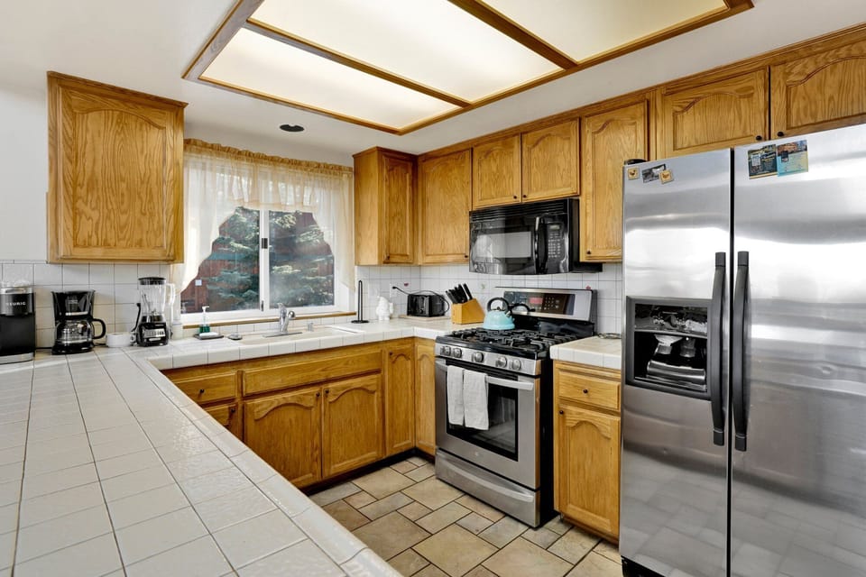 The fully equipped kitchen offers everything you need to cook, gather, and entertain perfect for meals, games, and shared moments.