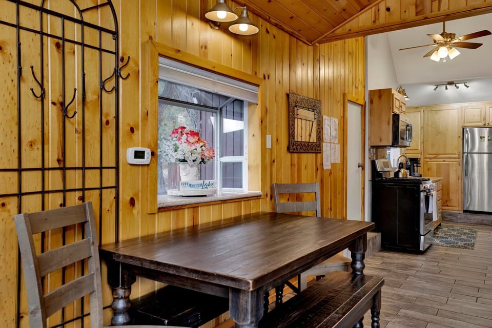 Gather around the dining table, which offers seating for four perfect for meals and game nights.