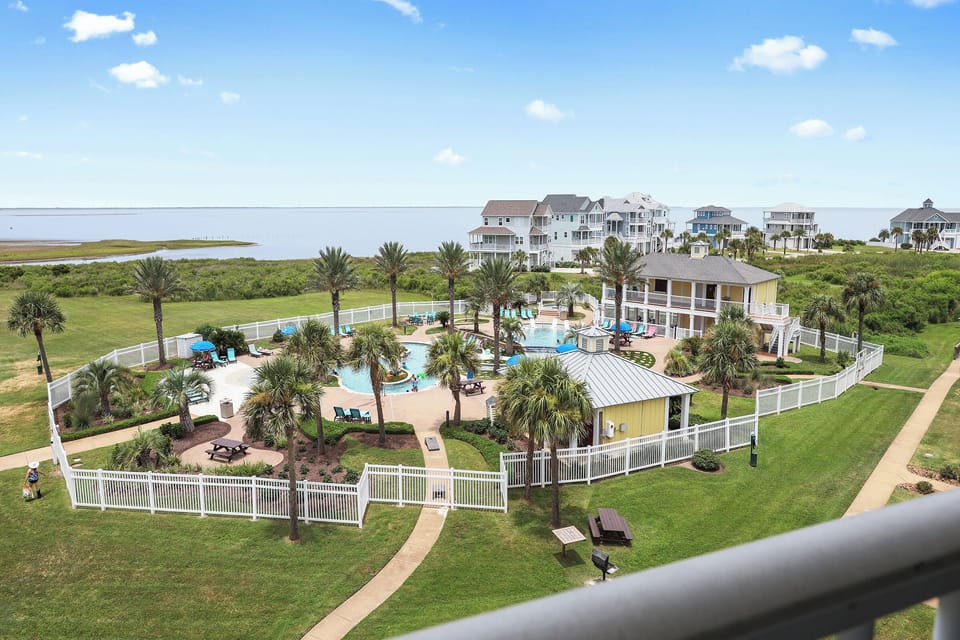 Your view of Sunset pool from the top floor  spacious balcony.