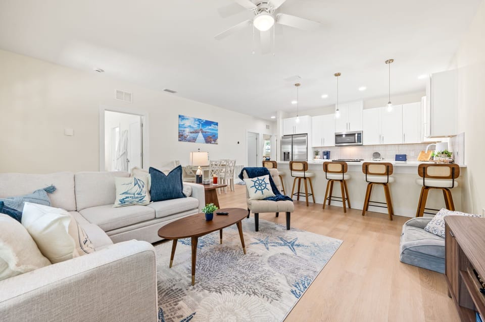 Spacious living room with 65" TV, fold-out couch & pet-friendly comfort