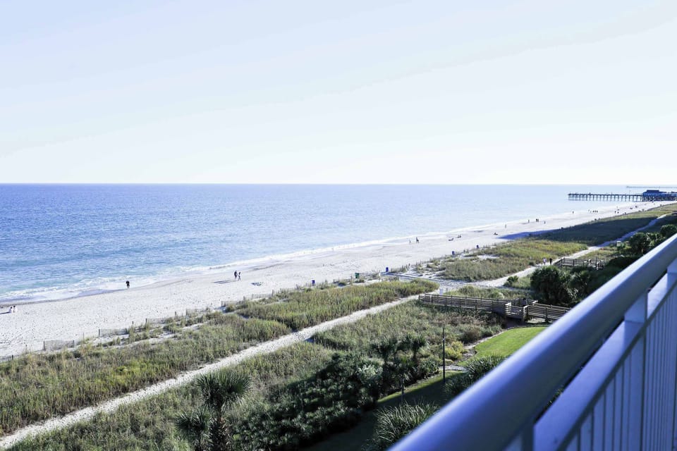 Front-row seat to paradise! Enjoy breathtaking ocean views from your private balcony—perfect for sunrise coffee or sunset wine. Just steps from the sand!