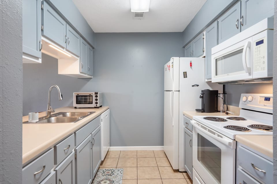 The airy kitchen offers ample space & all the comforts of home​