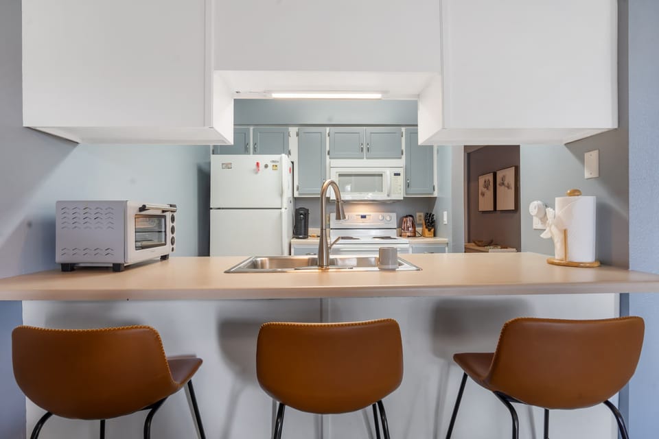 Sip morning coffee or an evening cocktail at the kitchen counter, seating 3​