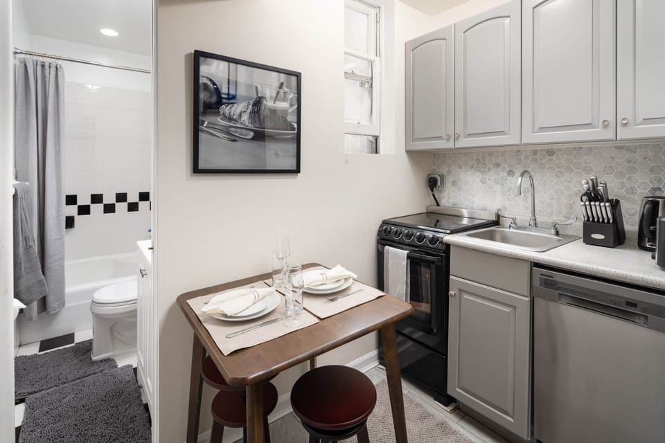 Compact kitchen with modern design and cozy dining.