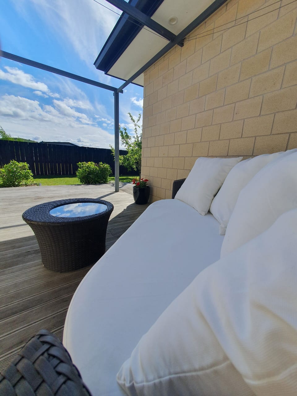 Sit back and relax, just outside the apartment.