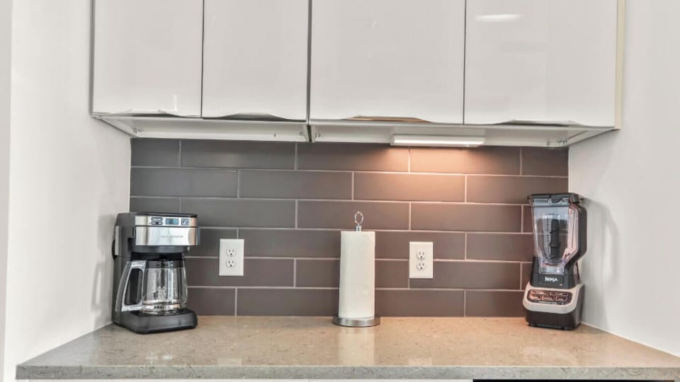 Stainless steel appliances, ample counter space, and a coffee machine for your convenience.