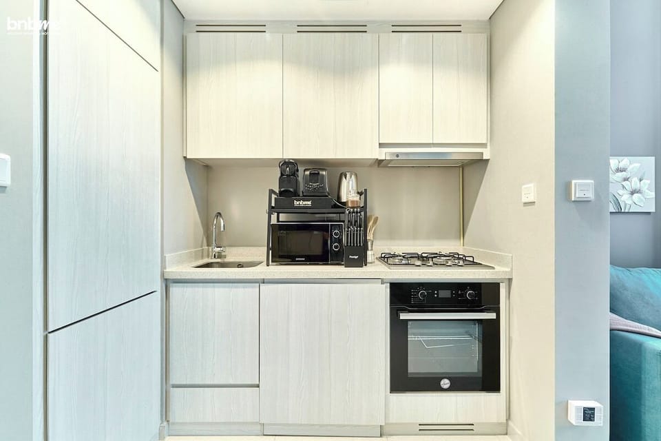Kitchen: "Channel your inner chef in our fully equipped modern kitchen."