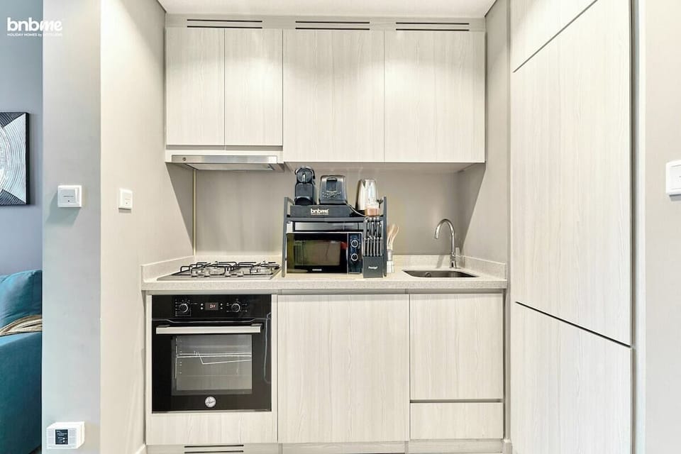 Cook up culinary delights in the modern kitchen, equipped with all the essentials for your convenience.