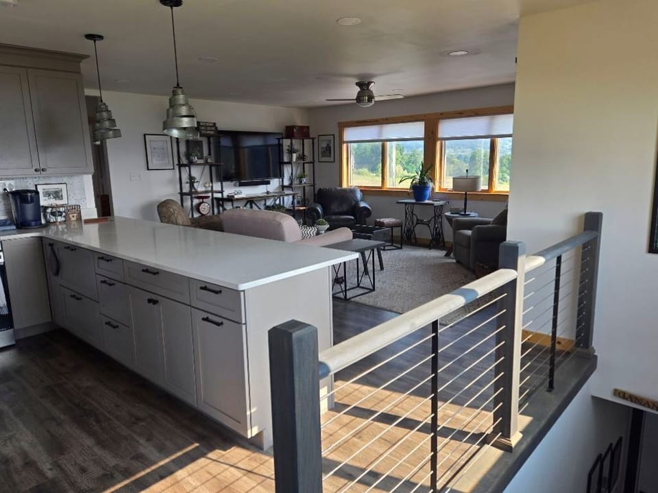 Large living room and adjacent kitchen space equipped with all the essentials