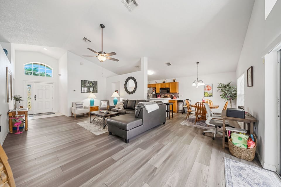 Inviting family room with large windows — enjoy bright Florida mornings